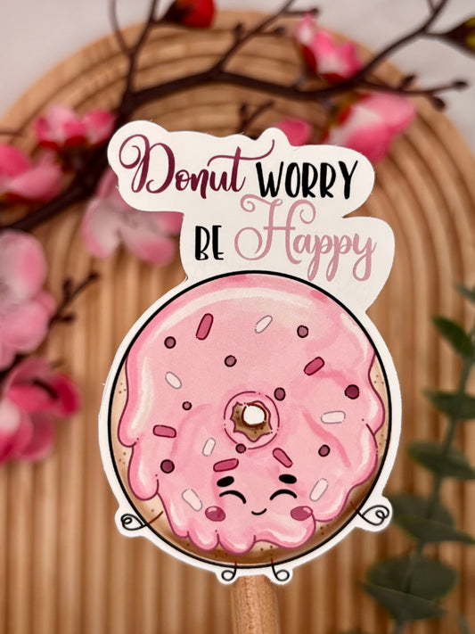 Close-up van donut sticker met vrolijke quote.