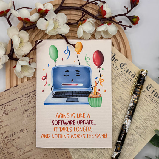 Wenskaart – Aging is Like a Software Update | Kawaii Laptop met Laadbalk
