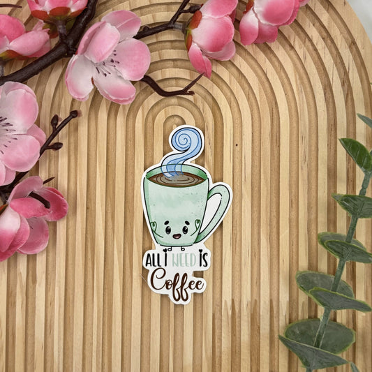 Die-cut sticker van koffiekop met de quote All I Need is Coffee.