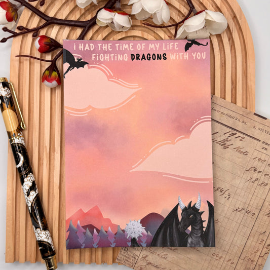 Notitieblok met draak op oranje wolken en fantasy quote – Fighting Dragons design.